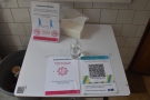 ... along with hand sanitiser and the QR Code for the NHS App.