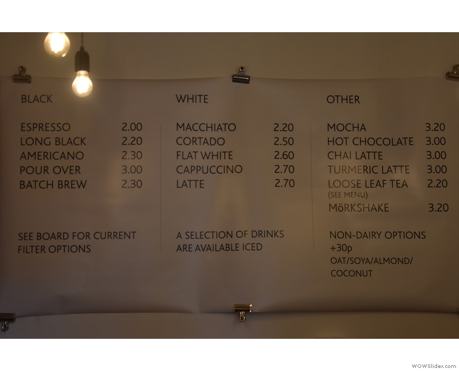The drinks menu is on the back wall...