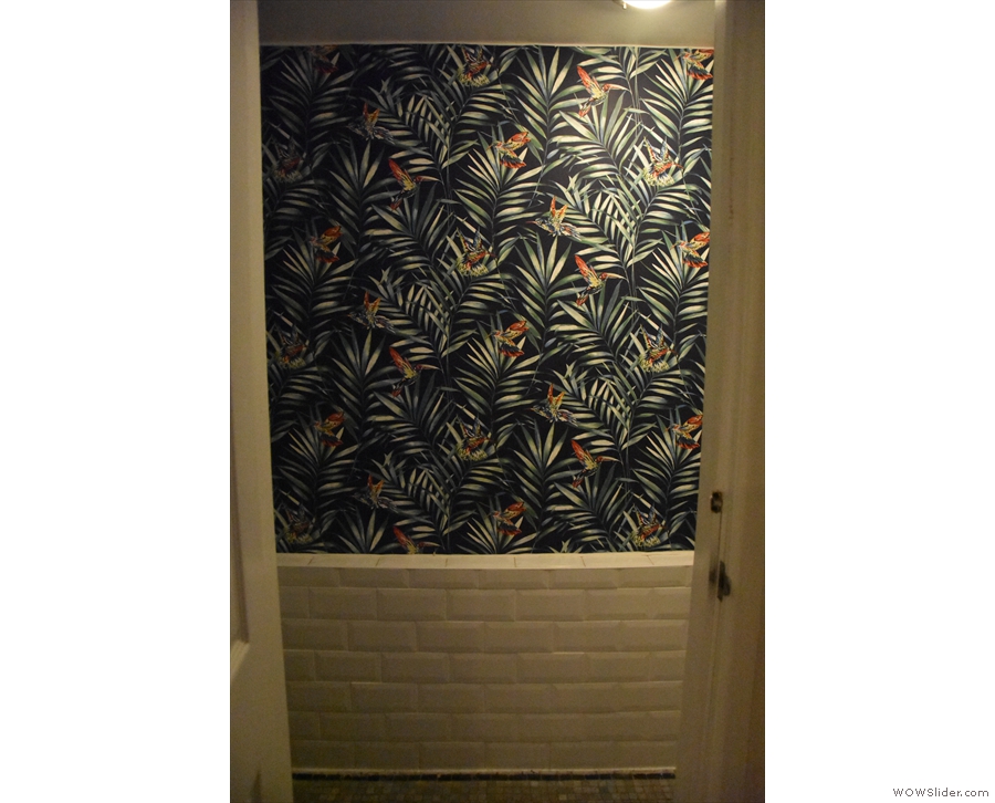 Meanwhile, in the basement, do check out the toilet, for some fabulous wallpaper...