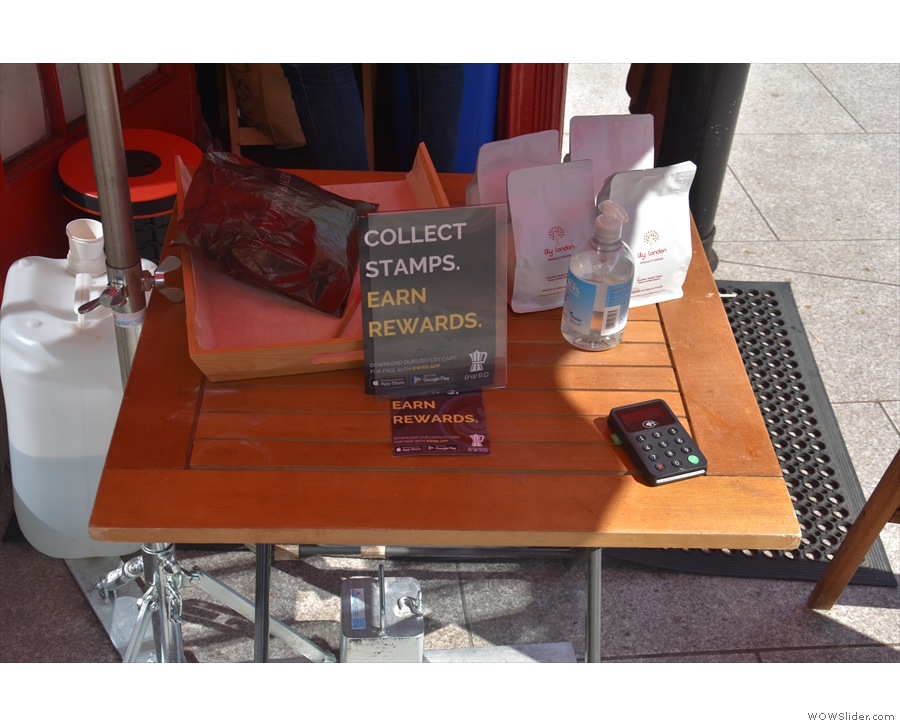 ... and there's a small table out front for the retail bags and card reader.