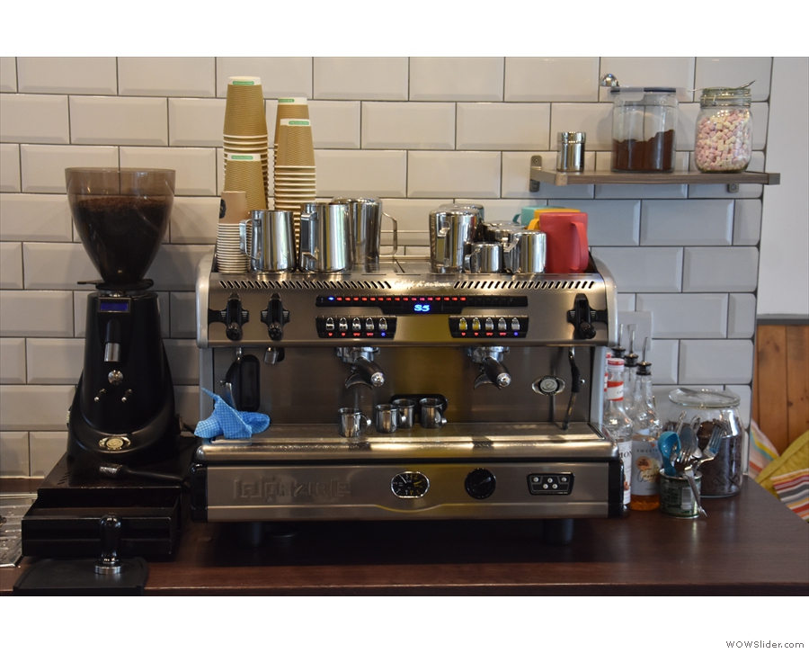 The espresso machine, meanwhile, is at the front end of the counter to the right...