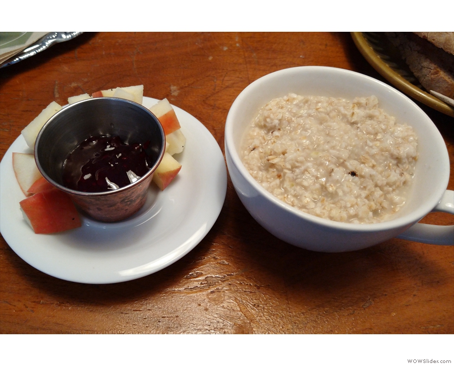 My porridge in detail, this time served in a large cup, along with some diced apple.