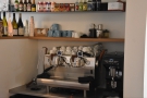 ... and the espresso machine off to the right. There's also a kitchen at the back.