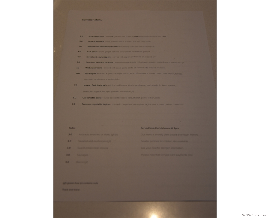There's a printed menu with food on one side...