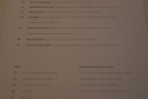 There's a printed menu with food on one side...