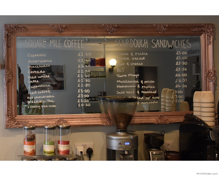 ... while the coffee and sandwich menus are written up on a mirror on the left-hand wall.