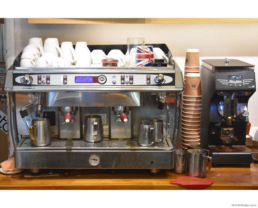 Meanwhile, the espresso machine and a Mythos One grinder are at the back of the counter.