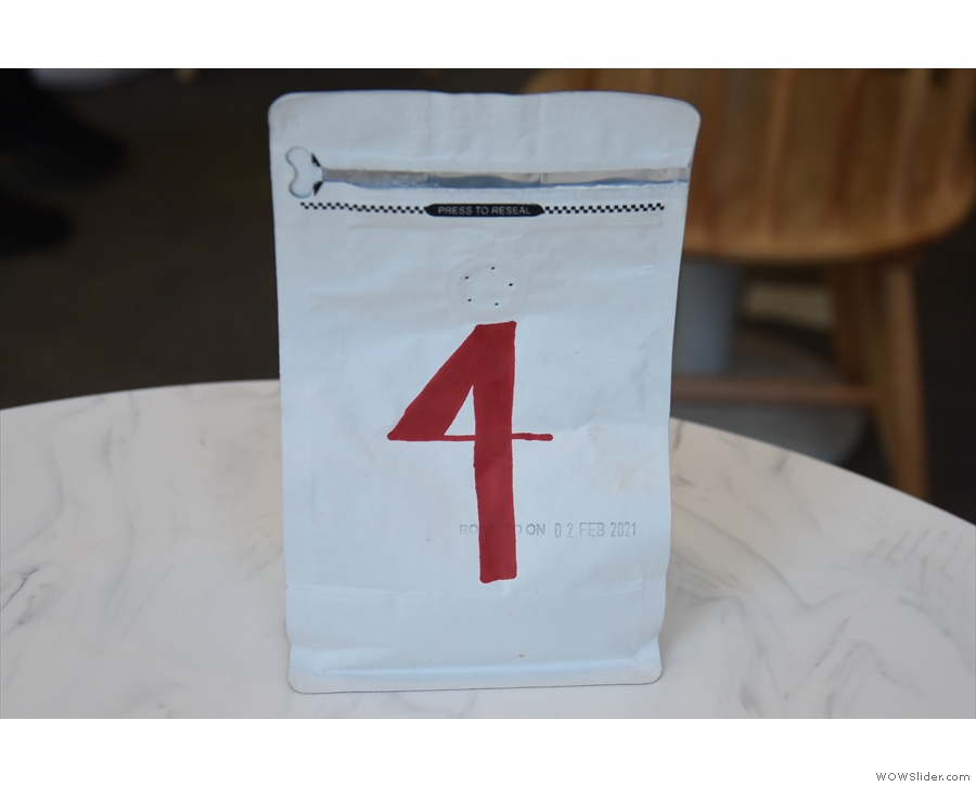 When you order, you are given a numbered bag of coffee to go on your table...