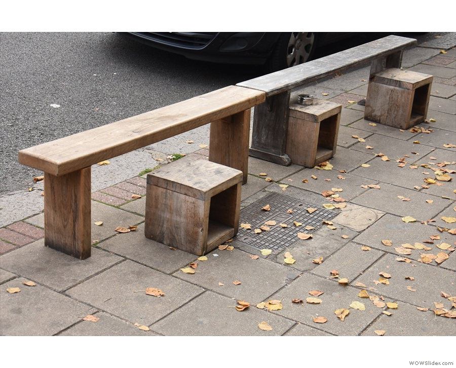 There's another pair of benches opposite on the edge of the pavement.