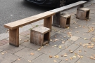 There's another pair of benches opposite on the edge of the pavement.