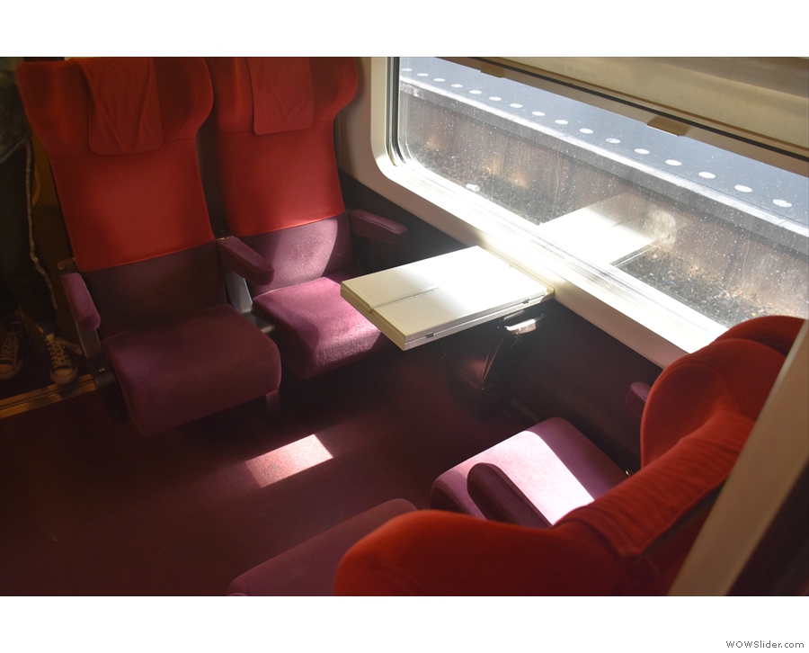 There's also a separate compartment with two sets of four seats with half-size tables.
