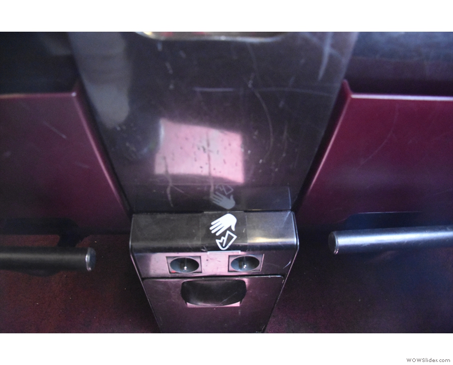 ... with the outlets conveniently located between the two seats in front. Bravo!