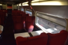 The main part of the carriage has five rows of airline-style seats, then a table set...