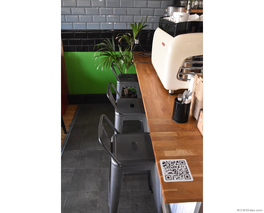 Finally, there are three tall stools at the front of the counter, ideal for barista-watching.