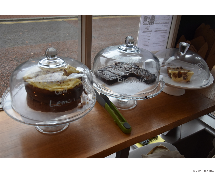 The cakes, meanwhile, are displayed in the window by the door...