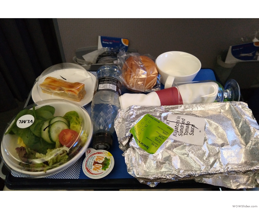 ... bringing lunch. It's still a single meal on a tray, but it's a cut above World Traveller...