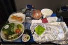 ... bringing lunch. It's still a single meal on a tray, but it's a cut above World Traveller...