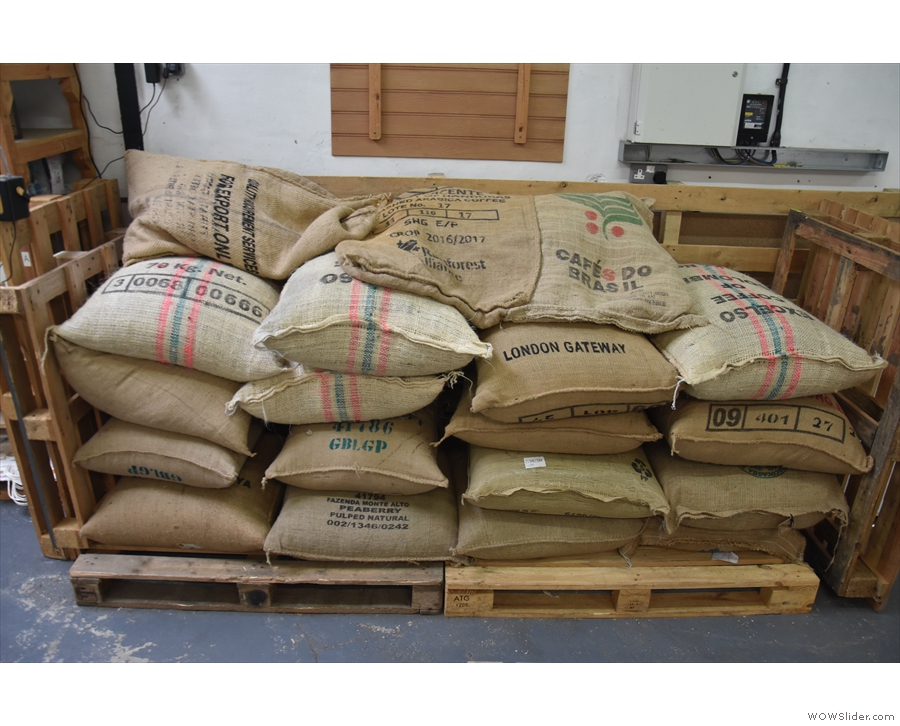 The roaster's job is to turn these (sacks of green beans)...