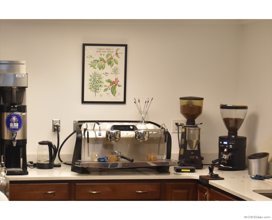 The heart of the operation, the epresso machine and its grinders, behind the counter.
