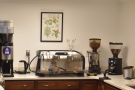 The heart of the operation, the epresso machine and its grinders, behind the counter.