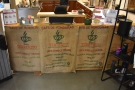 The front of the counter is decorated with coffee sacks from Honduras.