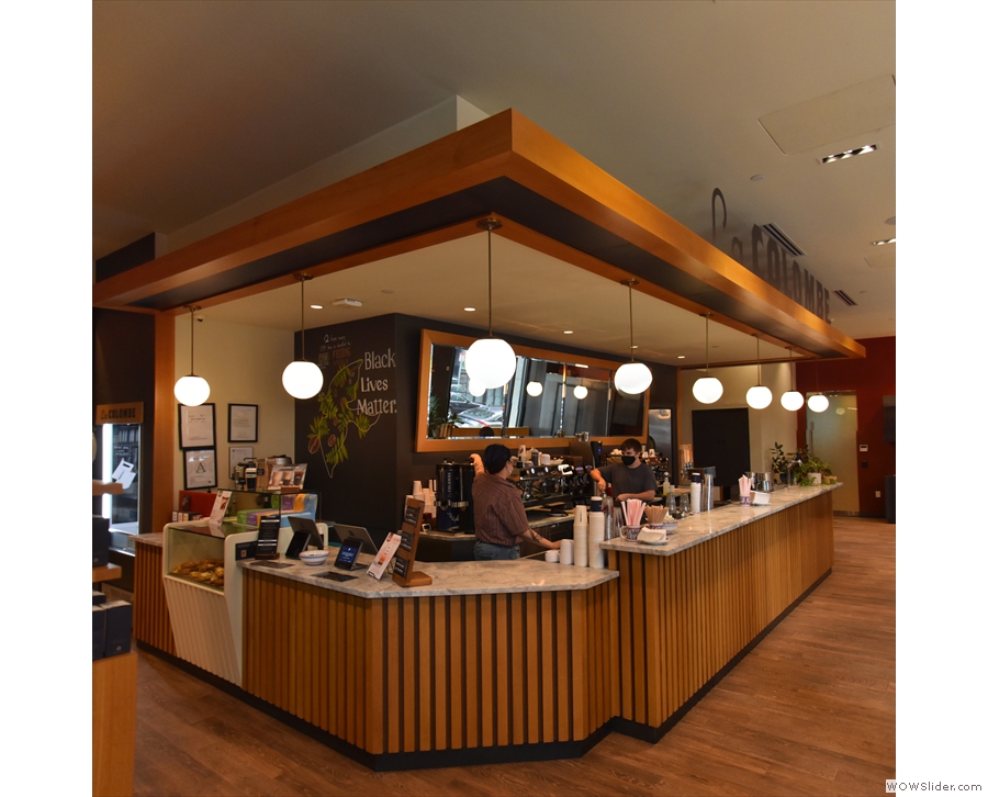The counter dominates the main part of La Colombe. The long side is parallel to the...