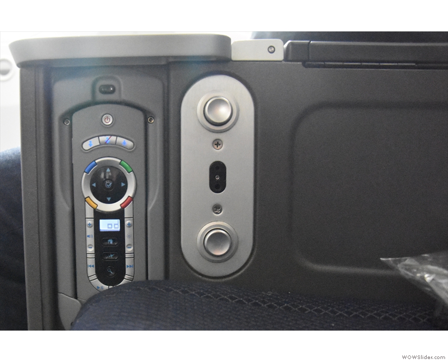 ... a remote control stowed in the other armrest (where you plug in your headset).