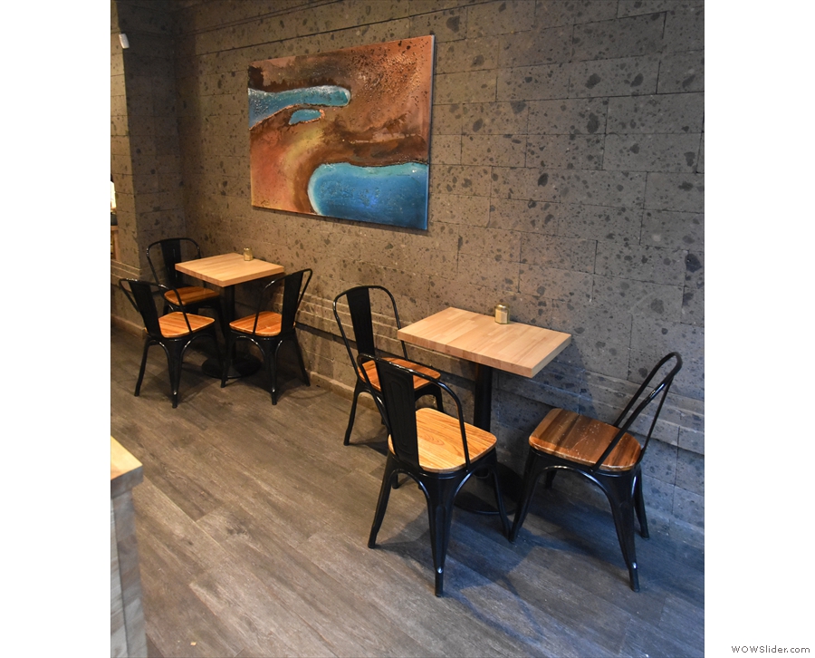 ... while opposite it, against the right-hand wall, are a pair of three-person tables.