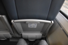 Let's take a look at my seat, starting with my impressive legroom. The table is in the...