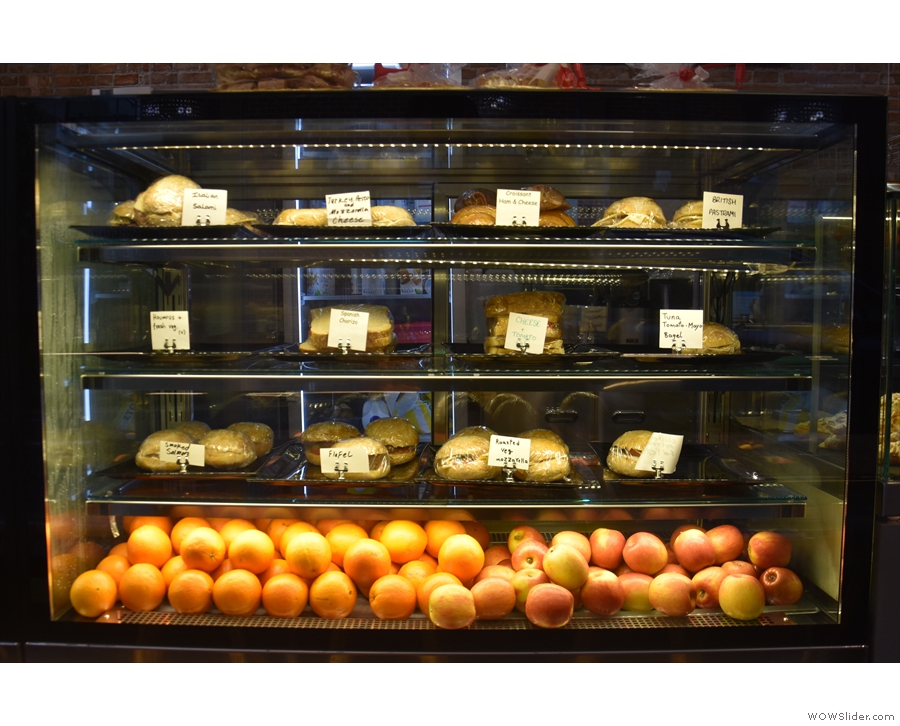 The next display case down holds the savoury items: a range of sandwiches and buns.