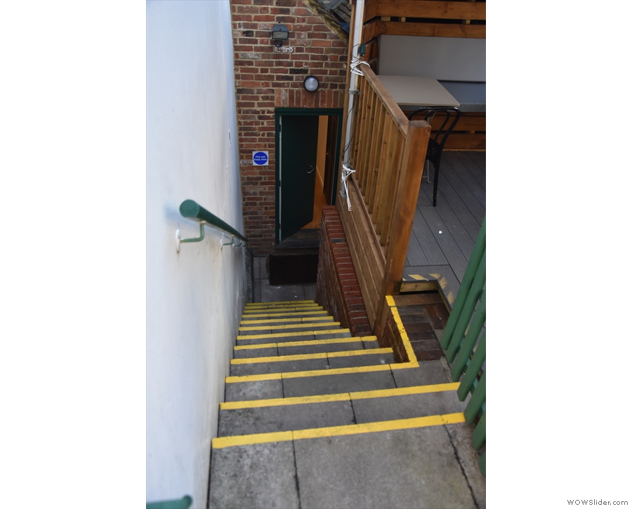 The steps down the left-hand side lead to both the seating area and the back door.