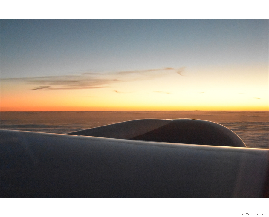 I was still in the window seat, enjoying the fiery glow of the sunset.