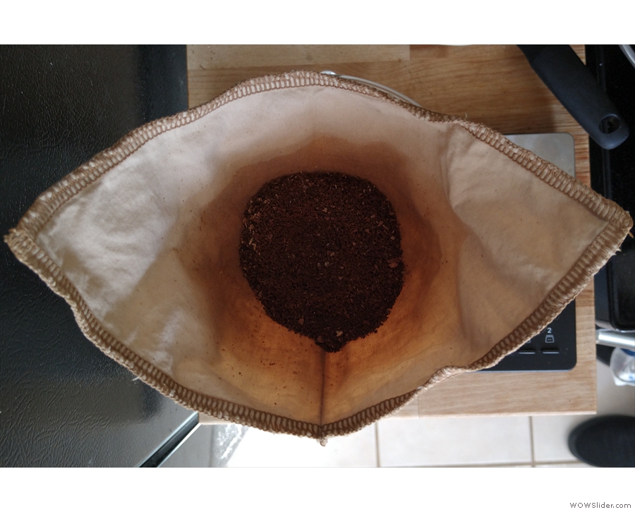 Put the ground coffee in the pre-rinsed filter...