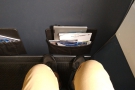 Behold my legroom. It's not much, but it will do (and is far better than the other rows).