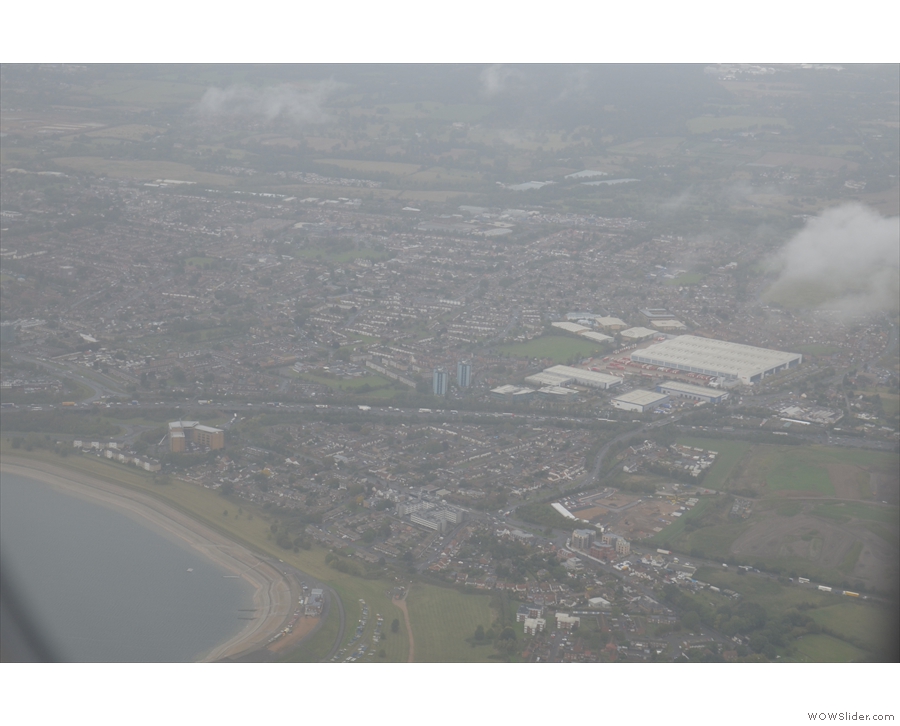 ... before flying over the Queen Mother Reservoir, with the M4 beyond that.