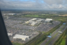 The airport is around 5 km inland, just beyond the M1 motorway. Check out the car parks!
