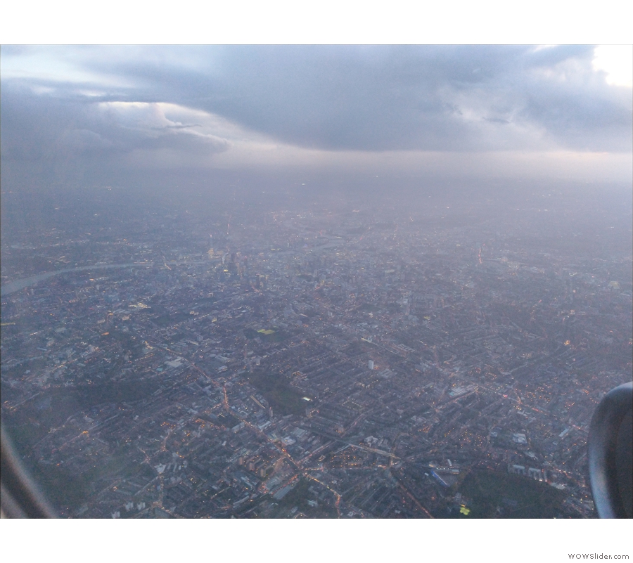 A panoramic view looking southwest across central London. You can see the Thames...