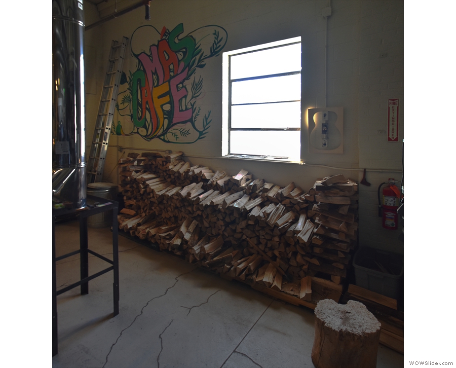 ... neat woodpile against the wall behind it. Yes, the roaster is wood-fired!