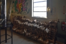 ... neat woodpile against the wall behind it. Yes, the roaster is wood-fired!