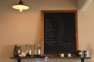 The concise menu is on a chalkboard above the espresso machine.