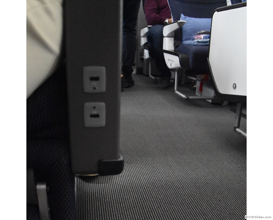 ... a separate pair of USB outlets per seat at the front of the seat arm.