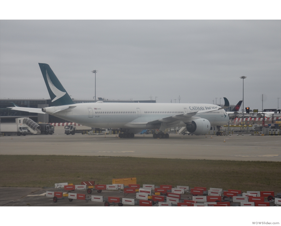 We were quickly on our way again, this time trundling past aircraft from Cathay Pacific...