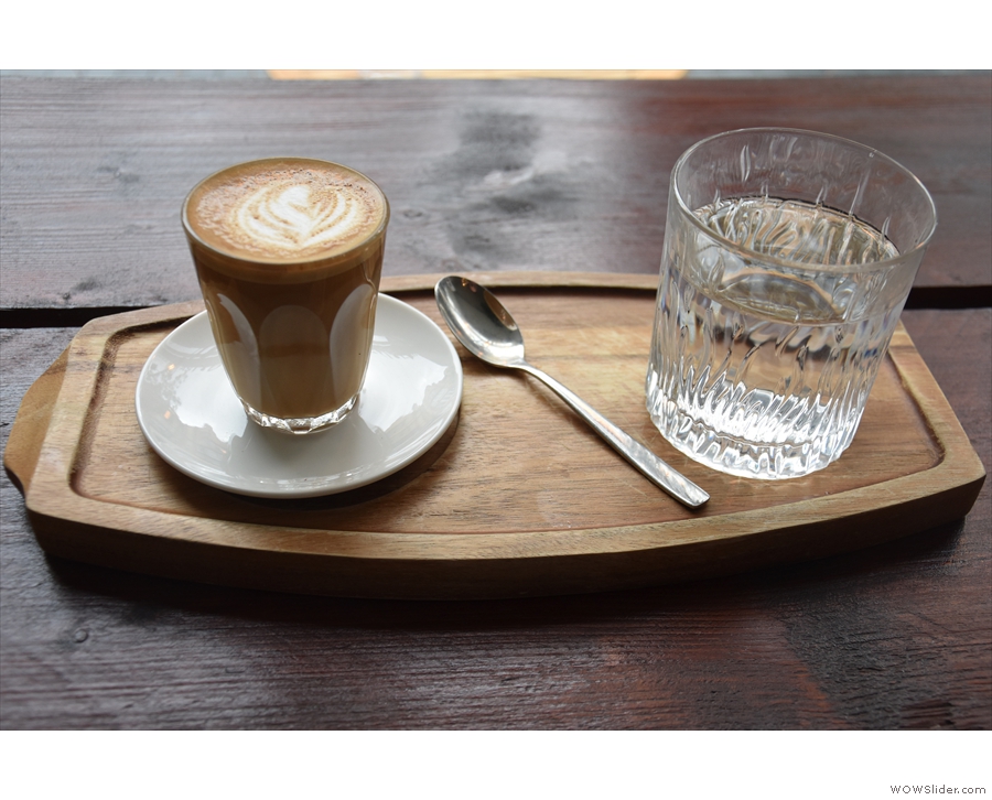 I went for a cortado, served in a glass, with a glass of water, all presented on a tray.