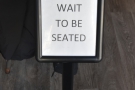 A polite notice greets you as you step inside (Haus offers full table service).