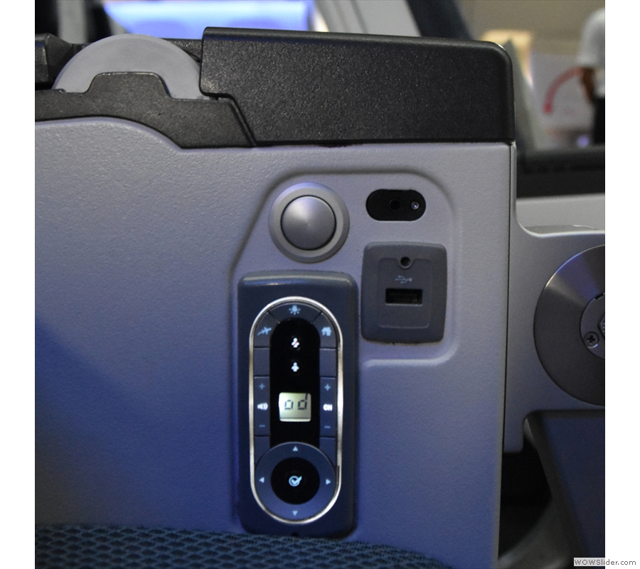 The USB power is in the inside of the armrest, along with the monitor remote control.