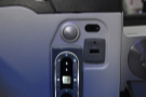 The USB power is in the inside of the armrest, along with the monitor remote control.