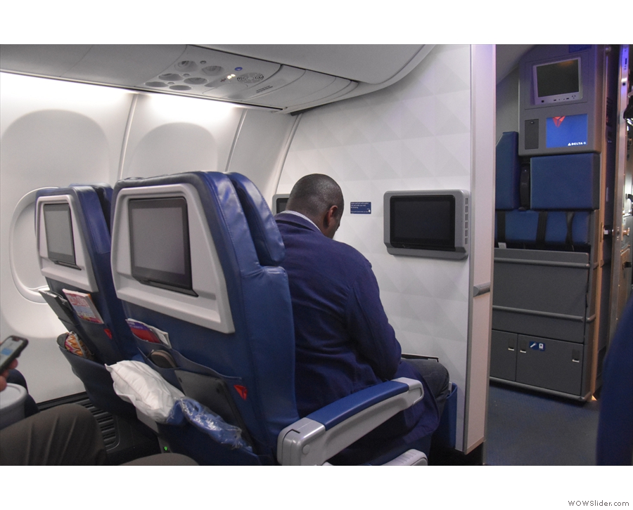 If you're in a front row seat your monitor and pockets are mounted on the bulkhead.
