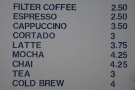 ... where you'll find the concise coffee menu on the wall behind...