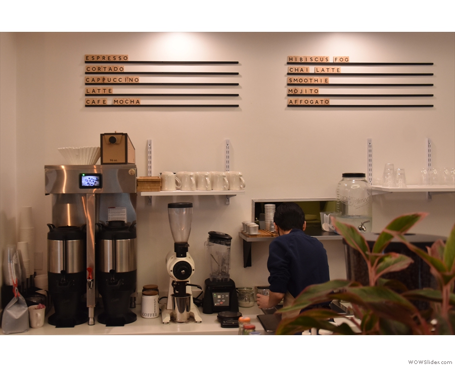 The various coffee options are on the back wall, above the batch brewer.