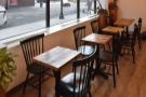 This is followed by a row of five two-person tables in the second set of windows.
